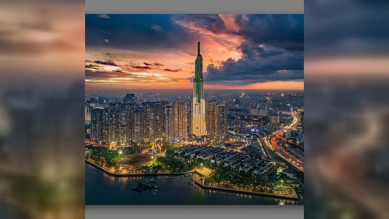 Landmark 81 rising above the surrounding city at sunset